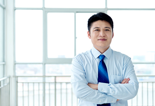 Young asian businessman in office